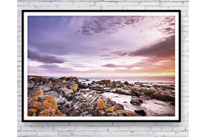 Ocean Rocky  Shore. Sunset over the ocean.